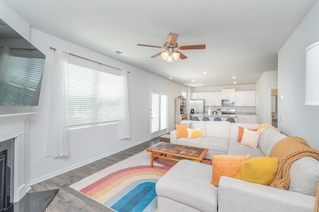 6058 Whitewater Dr, North Augusta, SC 29841 - living area with ceiling fan, wood finished floors, a fireplace, and recessed lighting
