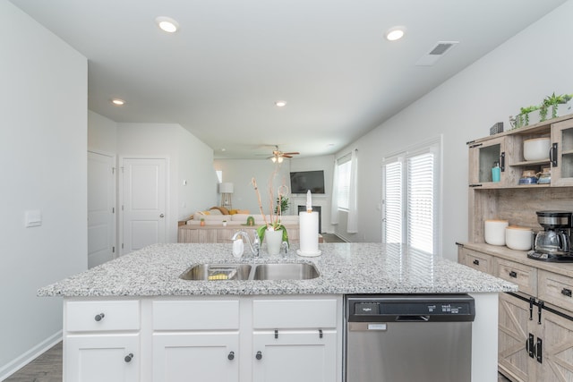 6058 Whitewater Dr, North Augusta, SC 29841 - kitchen with dishwasher, ceiling fan, open floor plan, white cabinetry, and light stone counters