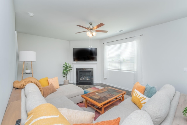 6058 Whitewater Dr, North Augusta, SC 29841 - living area featuring wood finished floors, a fireplace with flush hearth, and ceiling fan