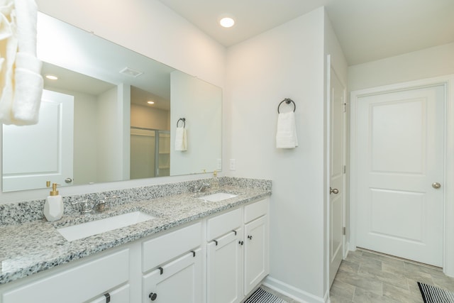 6058 Whitewater Dr, North Augusta, SC 29841 - bathroom with double vanity, an enclosed shower, and recessed lighting