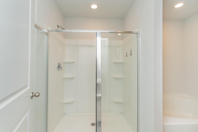 6058 Whitewater Dr, North Augusta, SC 29841 - bathroom featuring a shower stall, a garden tub, and recessed lighting