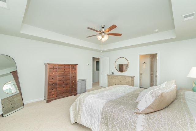 6058 Whitewater Dr, North Augusta, SC 29841 - carpeted bedroom with a tray ceiling, a ceiling fan, and ensuite bath