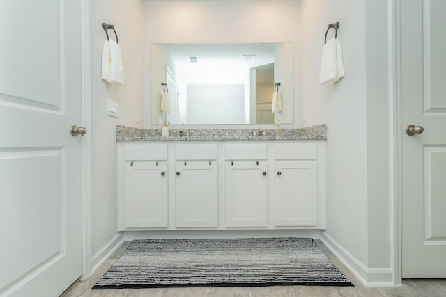 6058 Whitewater Dr, North Augusta, SC 29841 - bathroom with double vanity and baseboards