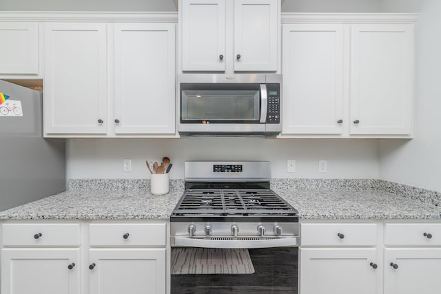 6058 Whitewater Dr, North Augusta, SC 29841 - kitchen featuring appliances with stainless steel finishes, white cabinets, and light stone countertops