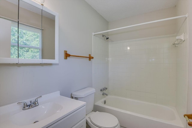 full bathroom featuring vanity, toilet, washtub / shower combination, and a textured ceiling