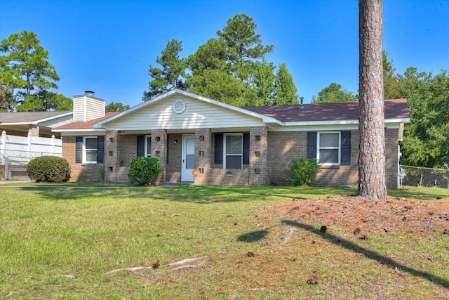 ranch-style house with a front lawn