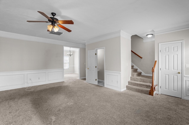 2807 Brickrun Way, Augusta, GA 30909 - carpeted spare room with crown molding, ceiling fan, a chandelier, a wainscoted wall, and stairs