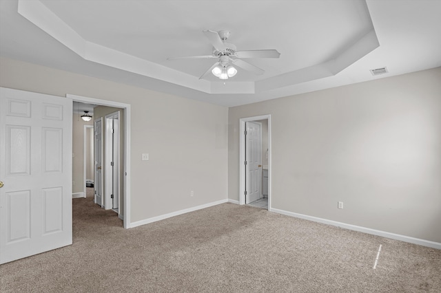 2807 Brickrun Way, Augusta, GA 30909 - unfurnished bedroom featuring a tray ceiling, carpet, ensuite bath, and ceiling fan