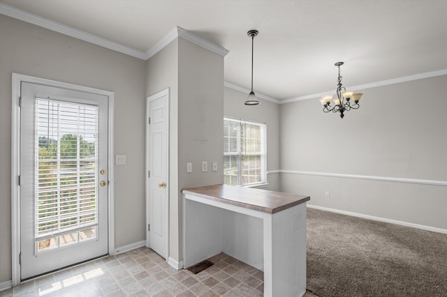 2807 Brickrun Way, Augusta, GA 30909 - kitchen featuring a chandelier, ornamental molding, decorative light fixtures, a peninsula, and wooden counters