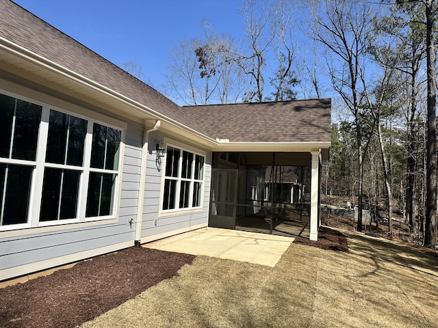 view of patio with a sunroom