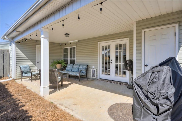 view of patio / terrace with an outdoor living space and french doors