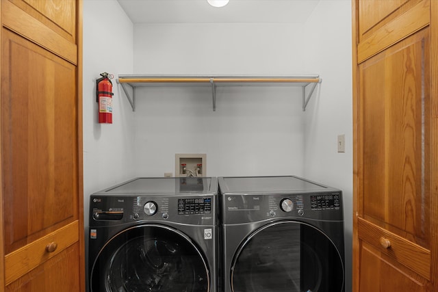 laundry room featuring washing machine and clothes dryer and laundry area