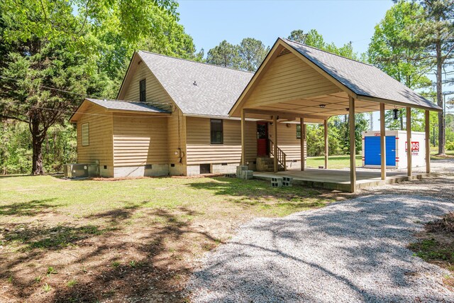 view of front of home with central AC unit, crawl space, a front lawn, entry steps, and roof with shingles