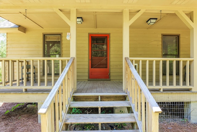 property entrance with covered porch