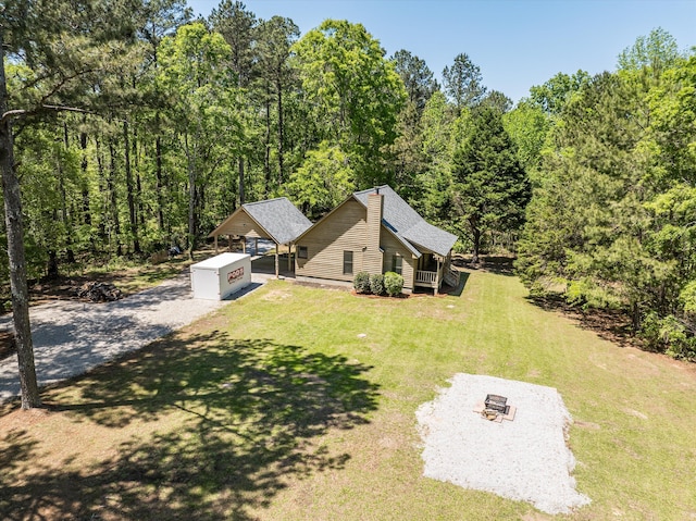 drone / aerial view featuring a view of trees
