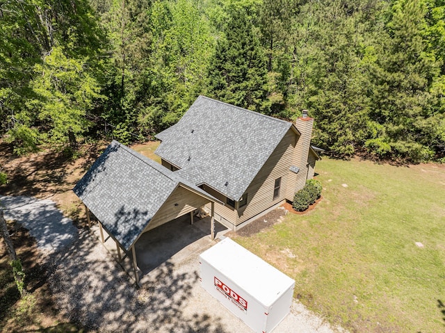 drone / aerial view featuring a forest view