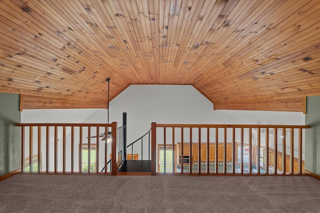 bonus room featuring vaulted ceiling, carpet flooring, and wood ceiling