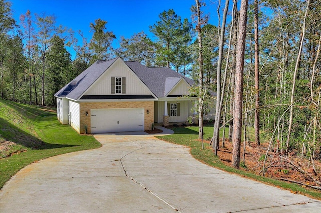 view of front of home featuring a garage and a front yard