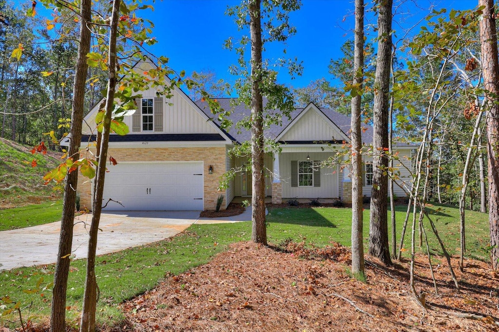 view of front facade with a front yard and a garage