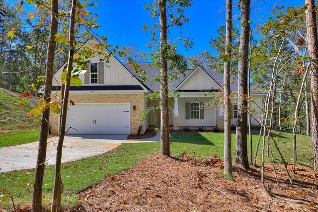 view of front facade with a front yard and a garage