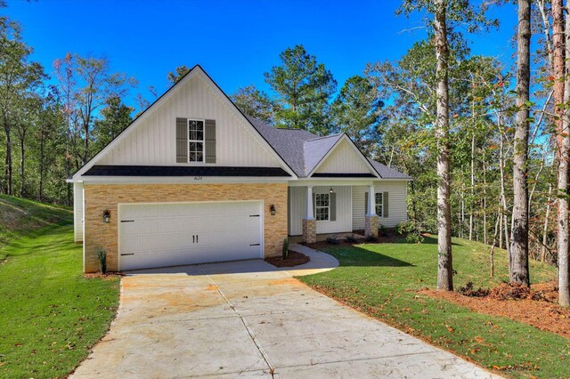 view of front facade with a garage and a front lawn