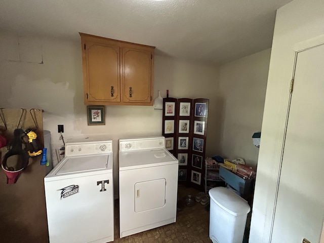 laundry area featuring washer and dryer and cabinet space