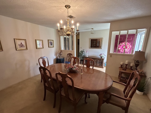 dining room with carpet flooring, a chandelier, and a textured ceiling