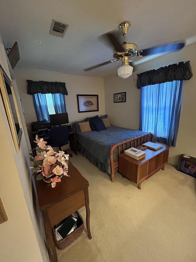 bedroom with carpet floors and a ceiling fan