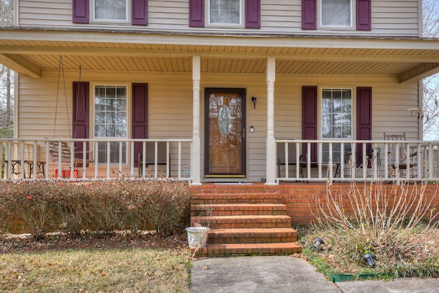 entrance to property with covered porch