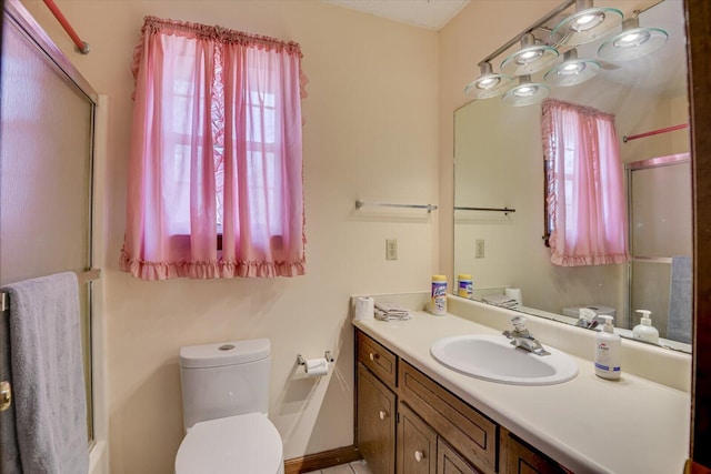 bathroom featuring toilet and vanity