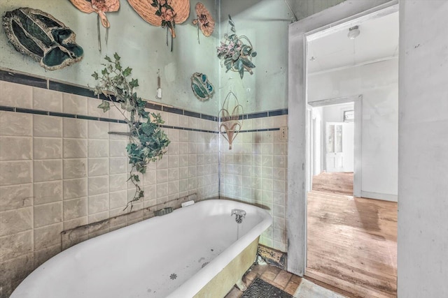 485 Adams St, Sparta, GA 31087 - full bathroom with a freestanding bath and tile walls