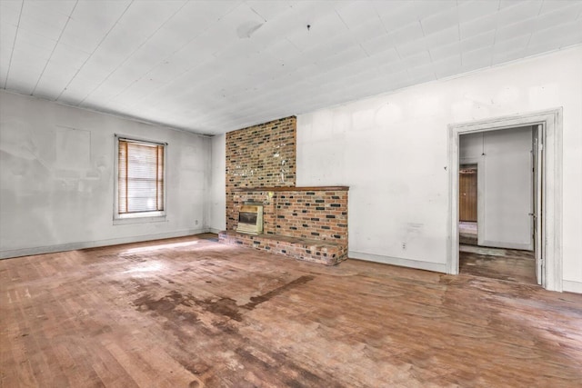485 Adams St, Sparta, GA 31087 - unfurnished living room with wood finished floors and baseboards