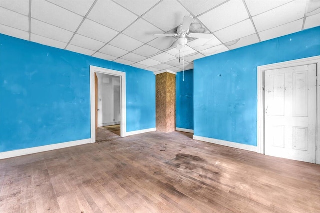 485 Adams St, Sparta, GA 31087 - empty room featuring a paneled ceiling, a ceiling fan, and wood finished floors