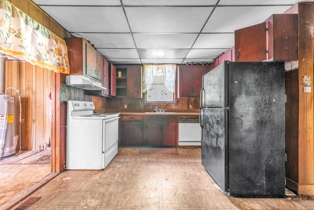 485 Adams St, Sparta, GA 31087 - kitchen with white appliances, under cabinet range hood, water heater, wooden walls, and a paneled ceiling