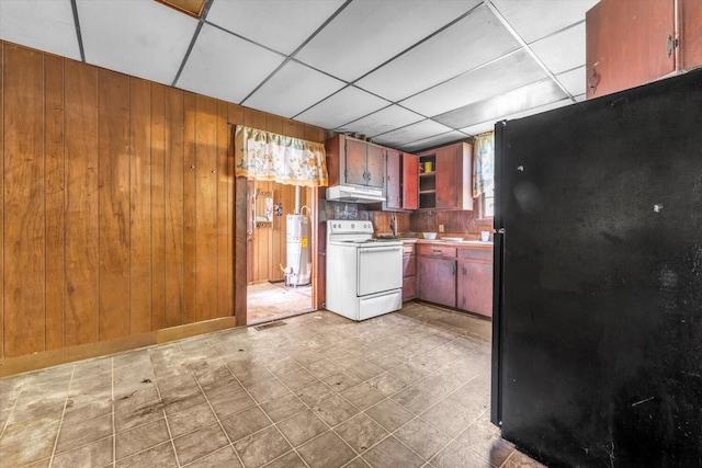 485 Adams St, Sparta, GA 31087 - kitchen with white electric range, freestanding refrigerator, under cabinet range hood, wood walls, and water heater