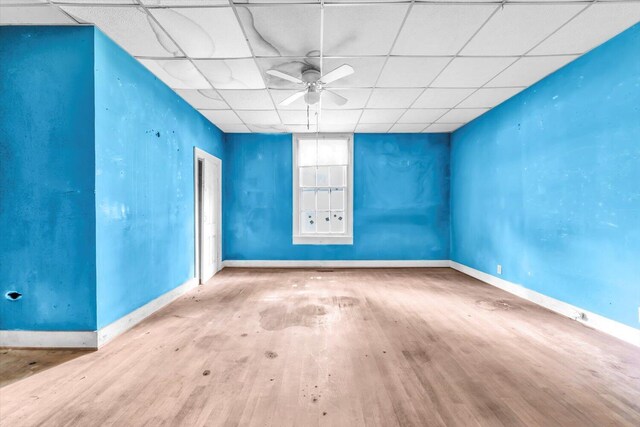 485 Adams St, Sparta, GA 31087 - unfurnished room with wood finished floors, ceiling fan, and a drop ceiling