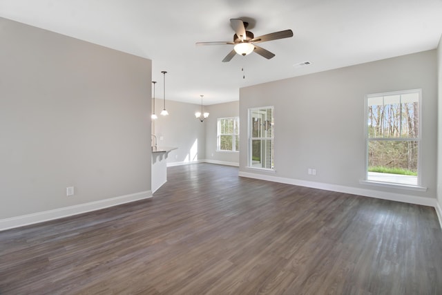 1675 Pine Ridge Dr N, Hephzibah, GA 30815 - unfurnished room featuring a chandelier, ceiling fan, dark wood finished floors, and baseboards