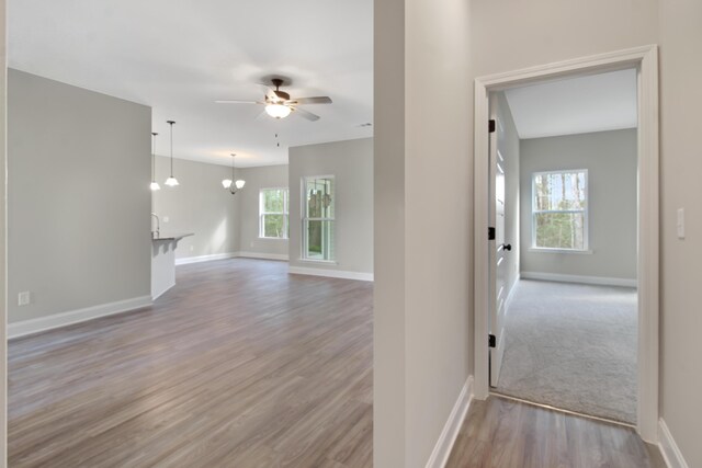 1675 Pine Ridge Dr N, Hephzibah, GA 30815 - spare room featuring ceiling fan, baseboards, wood finished floors, and a chandelier