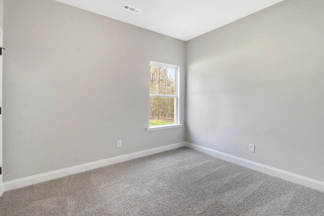 1675 Pine Ridge Dr N, Hephzibah, GA 30815 - spare room with baseboards and carpet floors