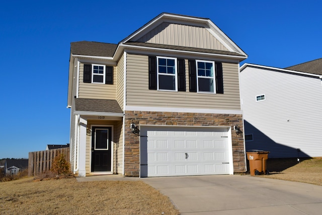 view of front of house with a front yard and a garage