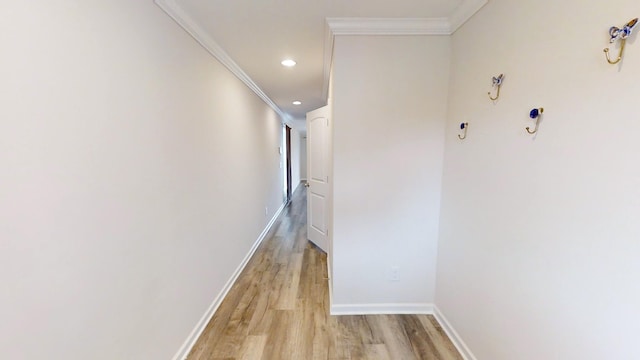 hall featuring light hardwood / wood-style flooring and crown molding