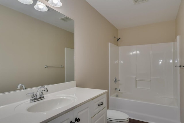 bathroom with visible vents, vanity, toilet, and tub / shower combination