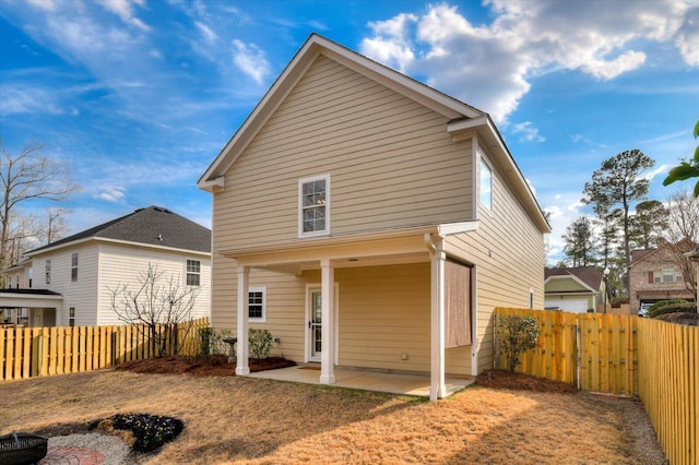 back of house featuring fence and a patio