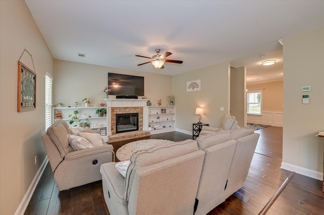 1548 Driftwood Ln, Grovetown, GA 30813 - living area featuring a brick fireplace, ceiling fan, and dark wood-type flooring
