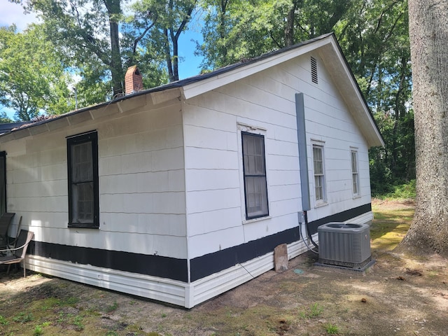 view of side of property with central AC unit