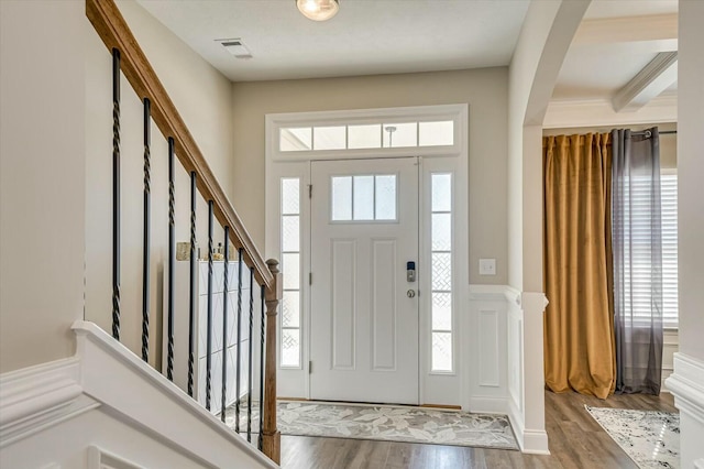 entryway with hardwood / wood-style floors