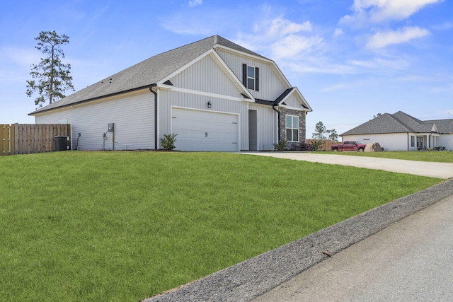 view of front of house featuring fence, roof with shingles, a front lawn, central AC unit, and concrete driveway