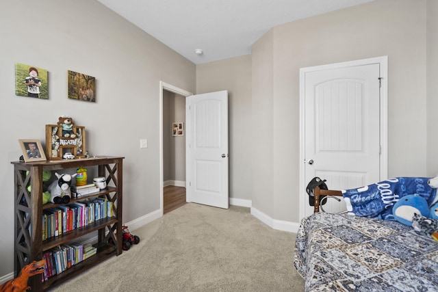 bedroom featuring carpet floors and baseboards