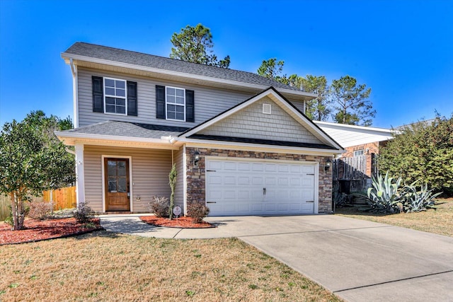 view of front facade featuring a front yard and a garage