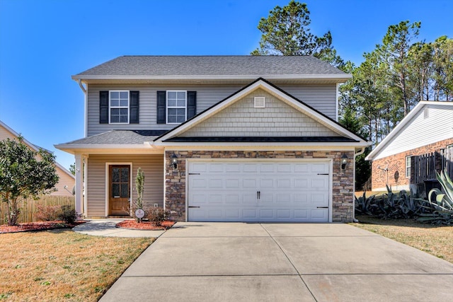 front of property featuring a garage and a front lawn